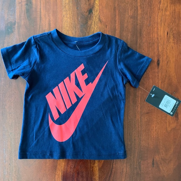 navy blue and red nike shirt